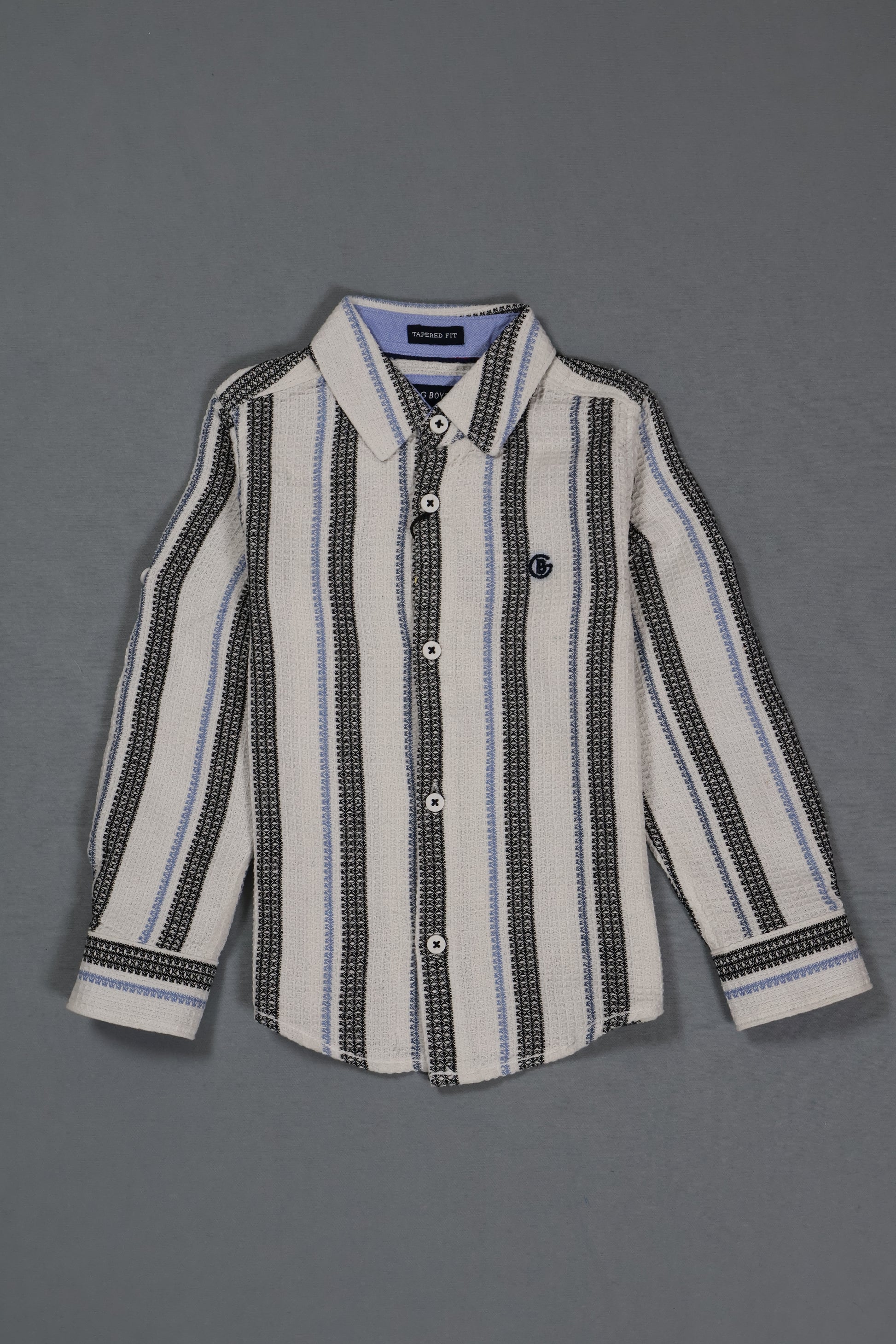 Striped shirt with black and white pattern on a gray background