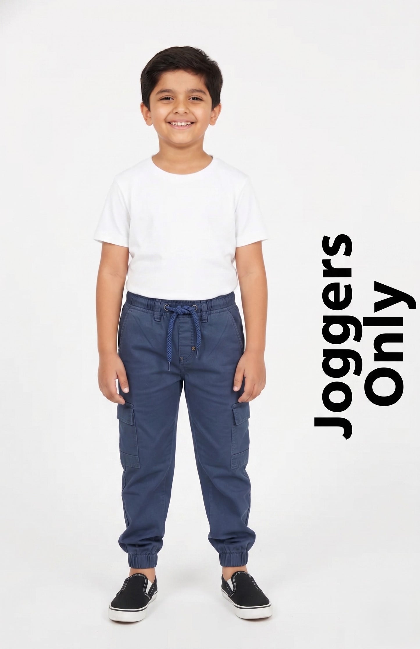 "A kid modeling Fyst navy blue cargo joggers featuring utility side pockets, an elastic drawstring waistband, and cinched ankle cuffs."