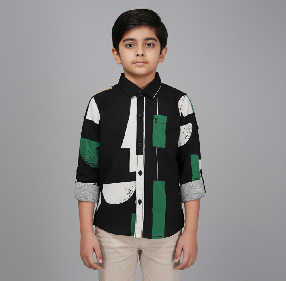 Boy wearing smart casual shirt with green and white botanical print, taupe grey background