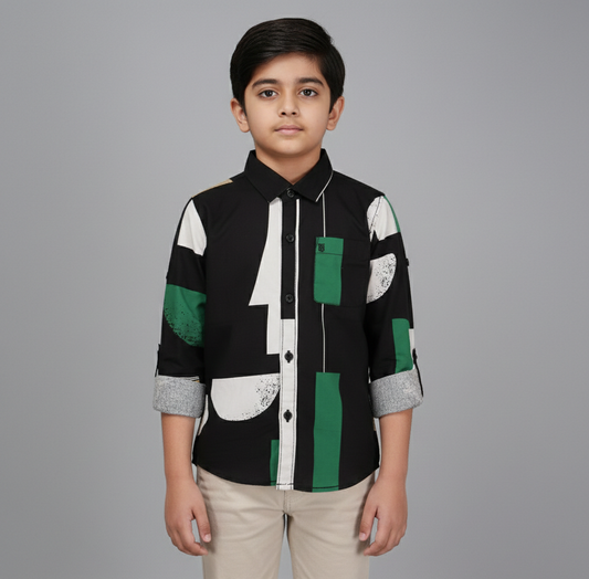 Boy wearing smart casual shirt with green and white botanical print, taupe grey background