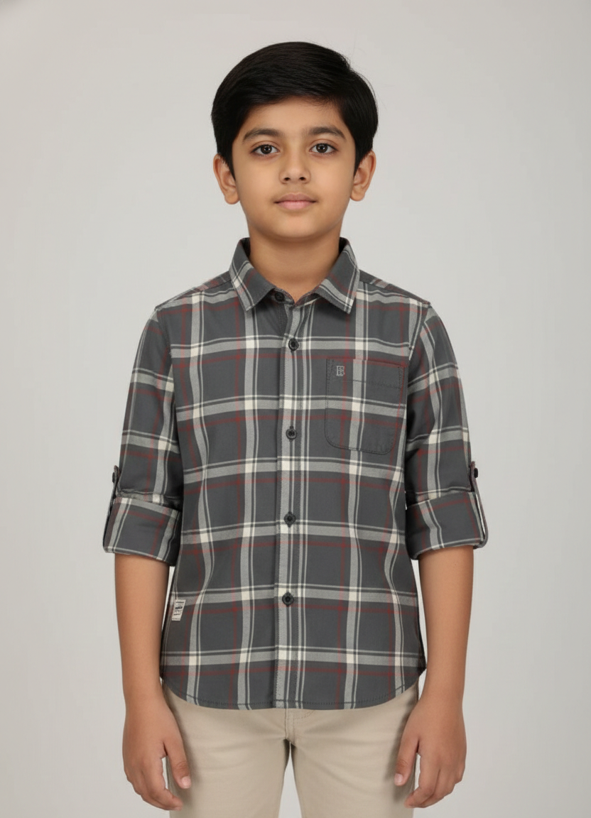 Boy wearing charcoal and rust check cotton shirt with rolled sleeves, smart casual style