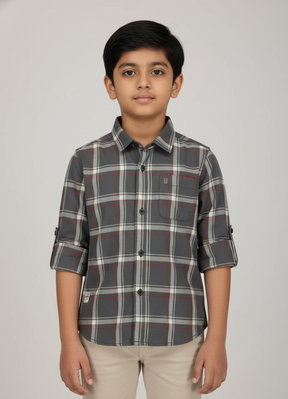 Boy wearing charcoal and rust check cotton shirt with rolled sleeves, smart casual style