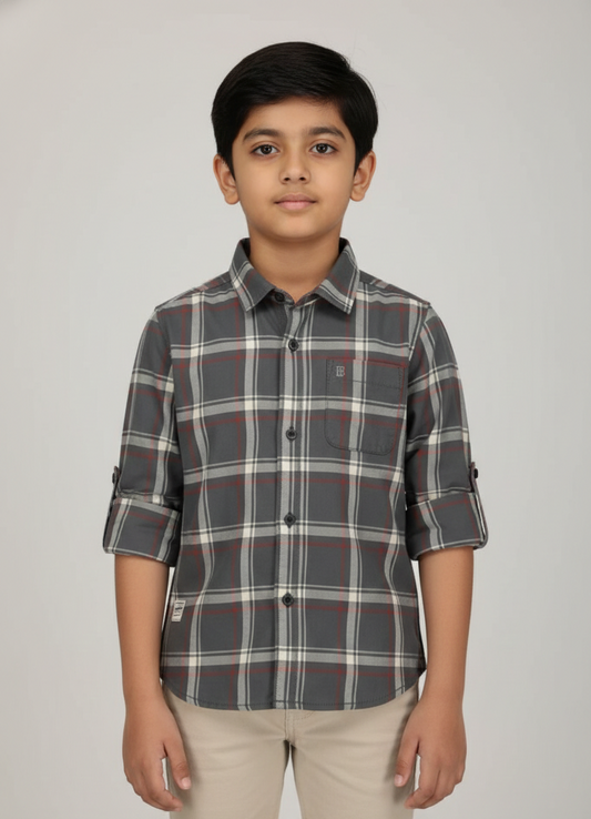 Boy wearing charcoal and rust check cotton shirt with rolled sleeves, smart casual style