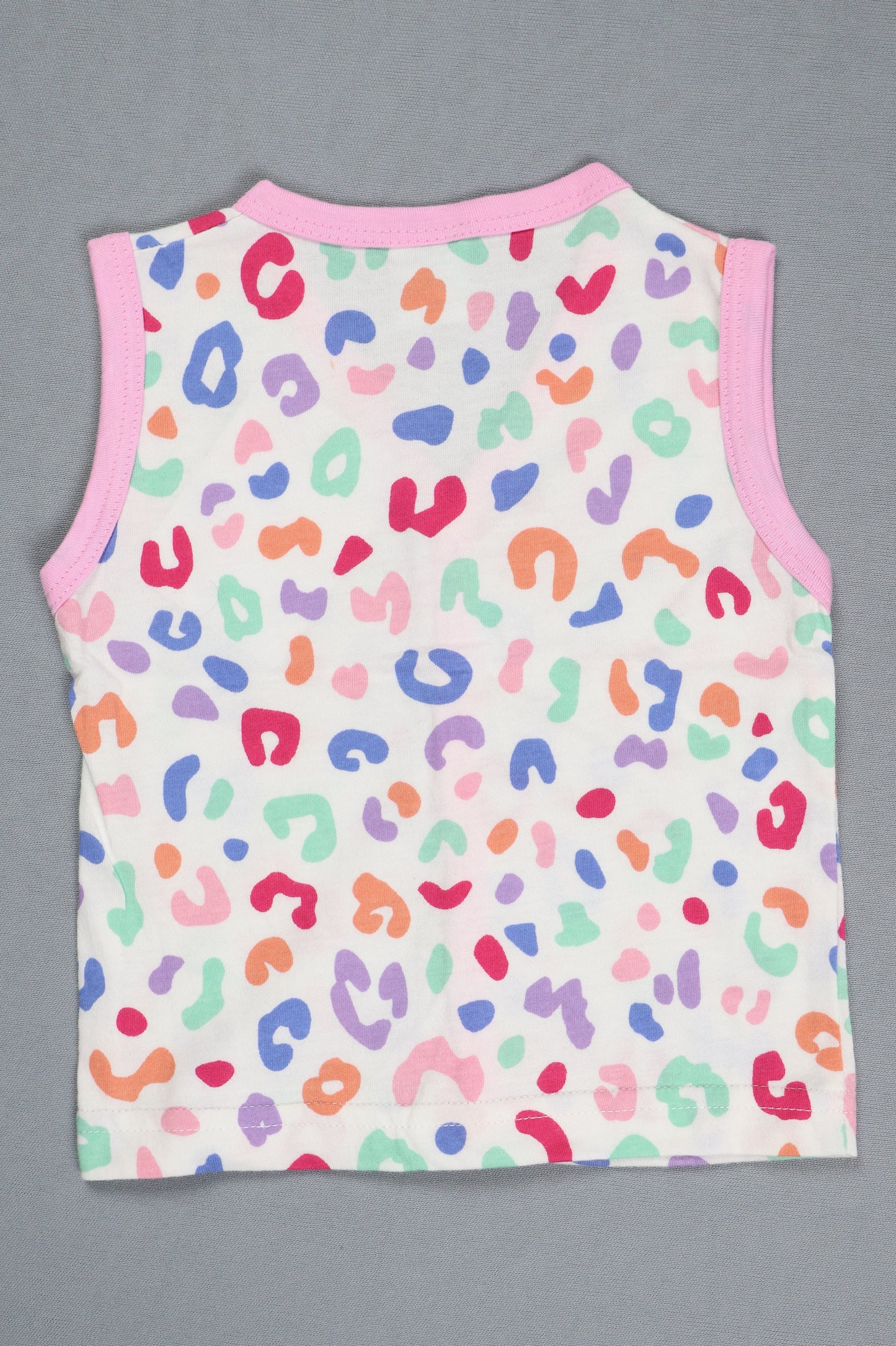 Colorful leopard print baby romper on a gray background