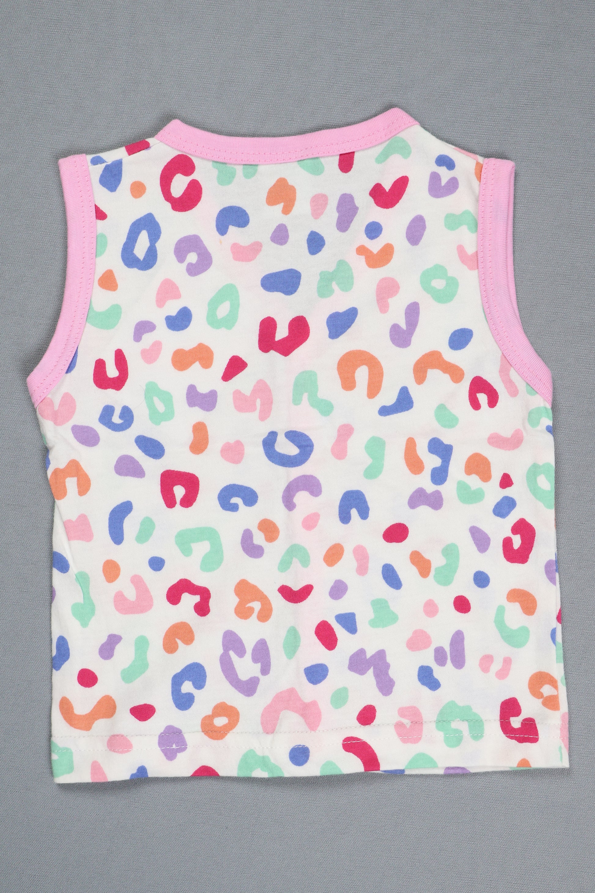 Colorful leopard print baby romper on a gray background