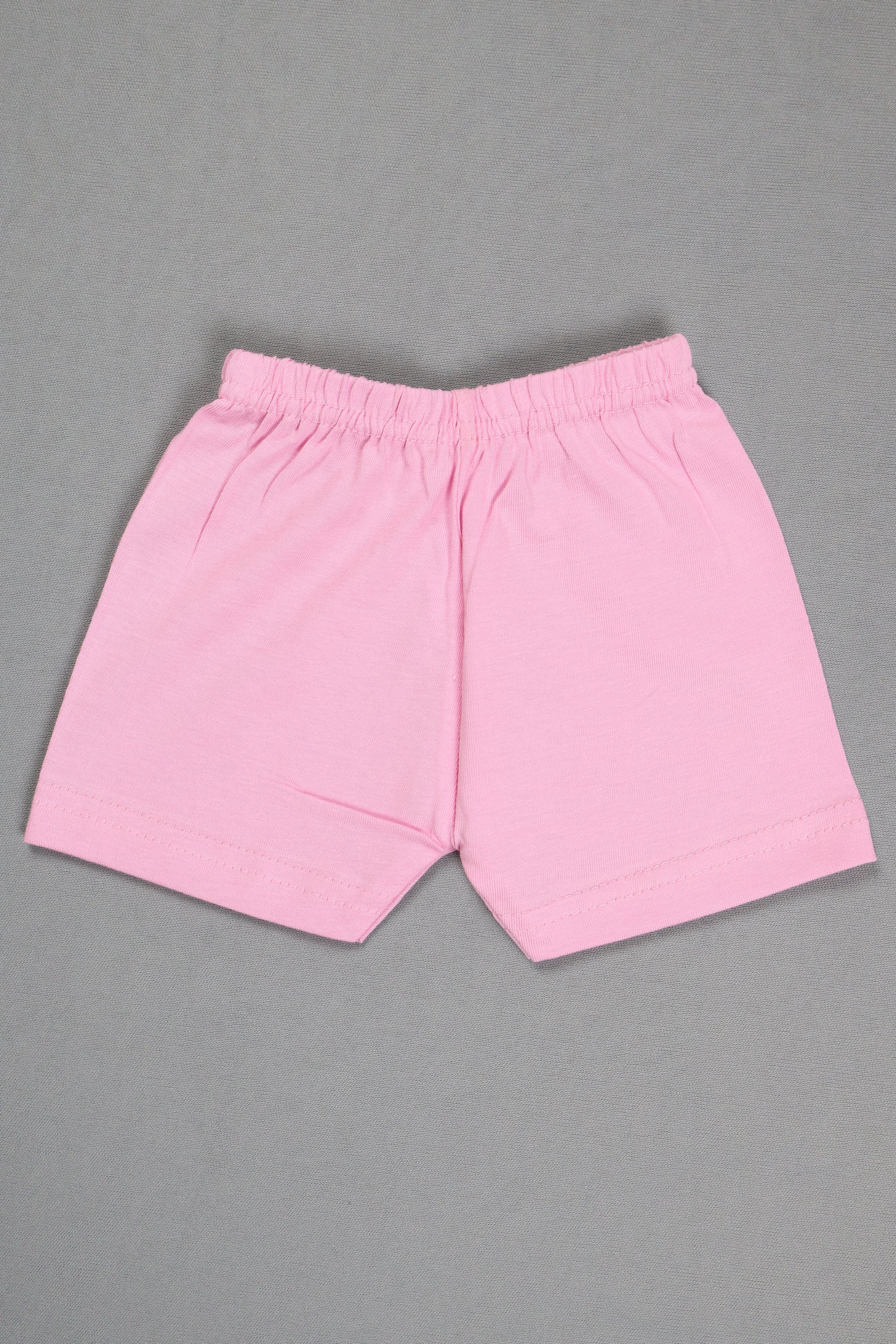 Pink shorts on a gray background