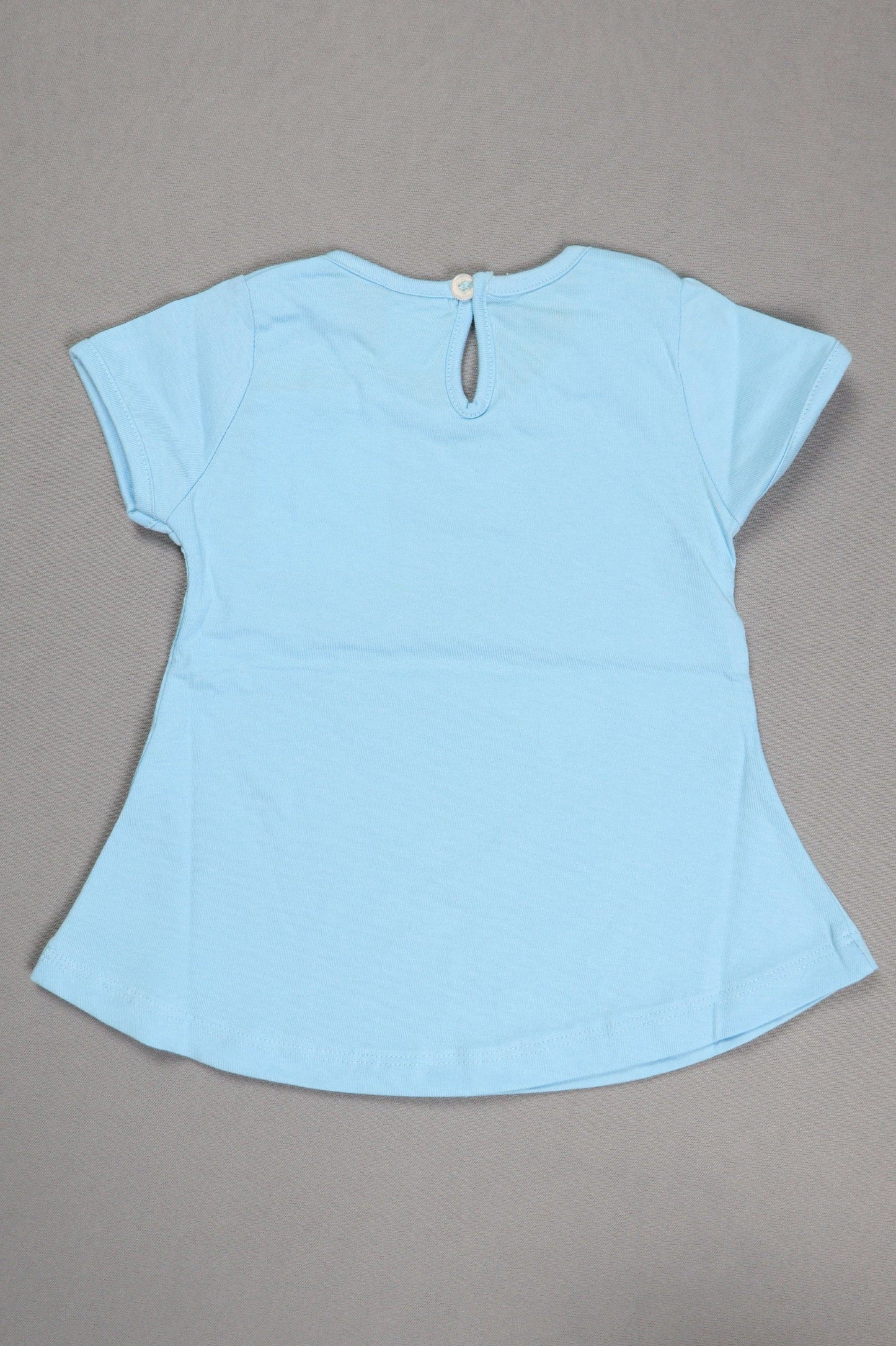 Light blue fabric piece on a gray background