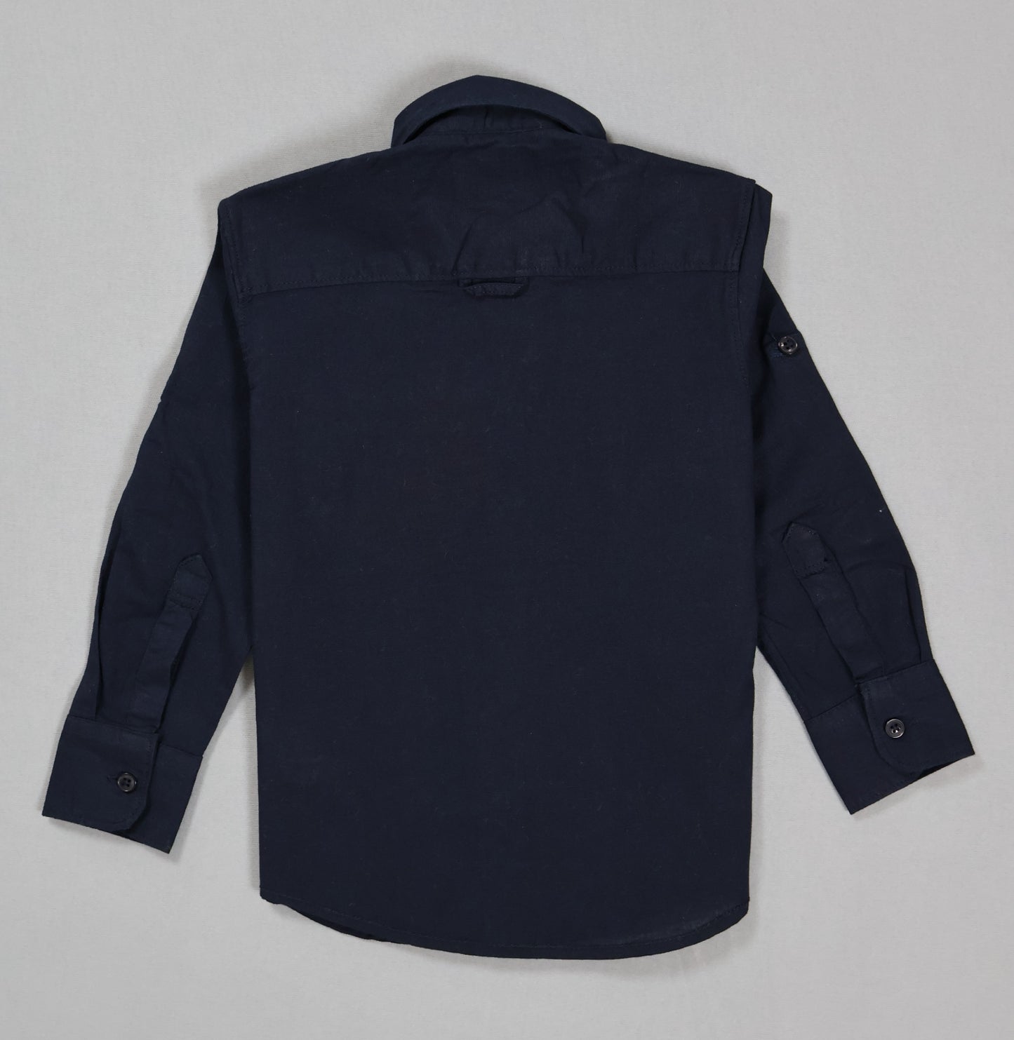 Navy blue shirt on a light gray background