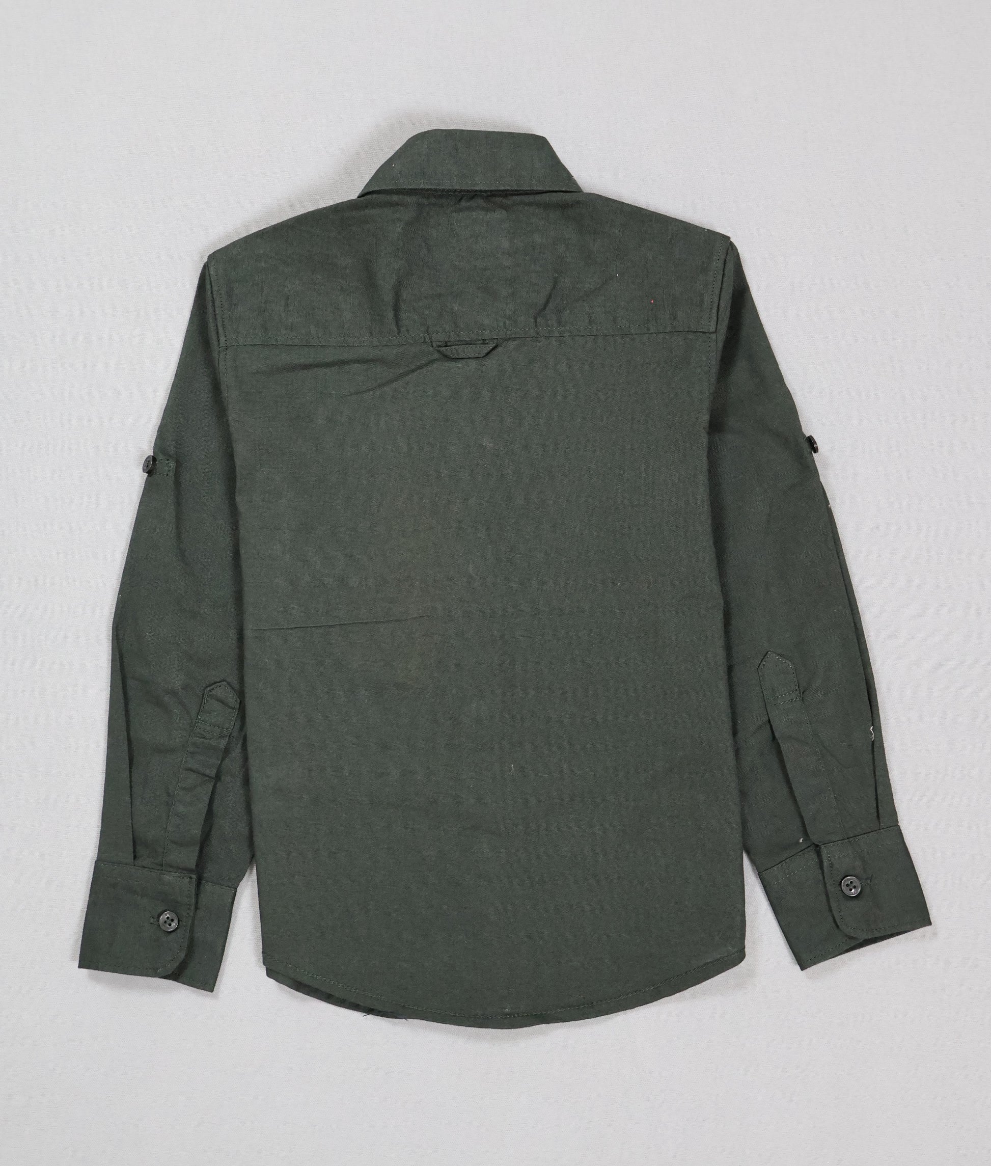 Green shirt on a light gray background