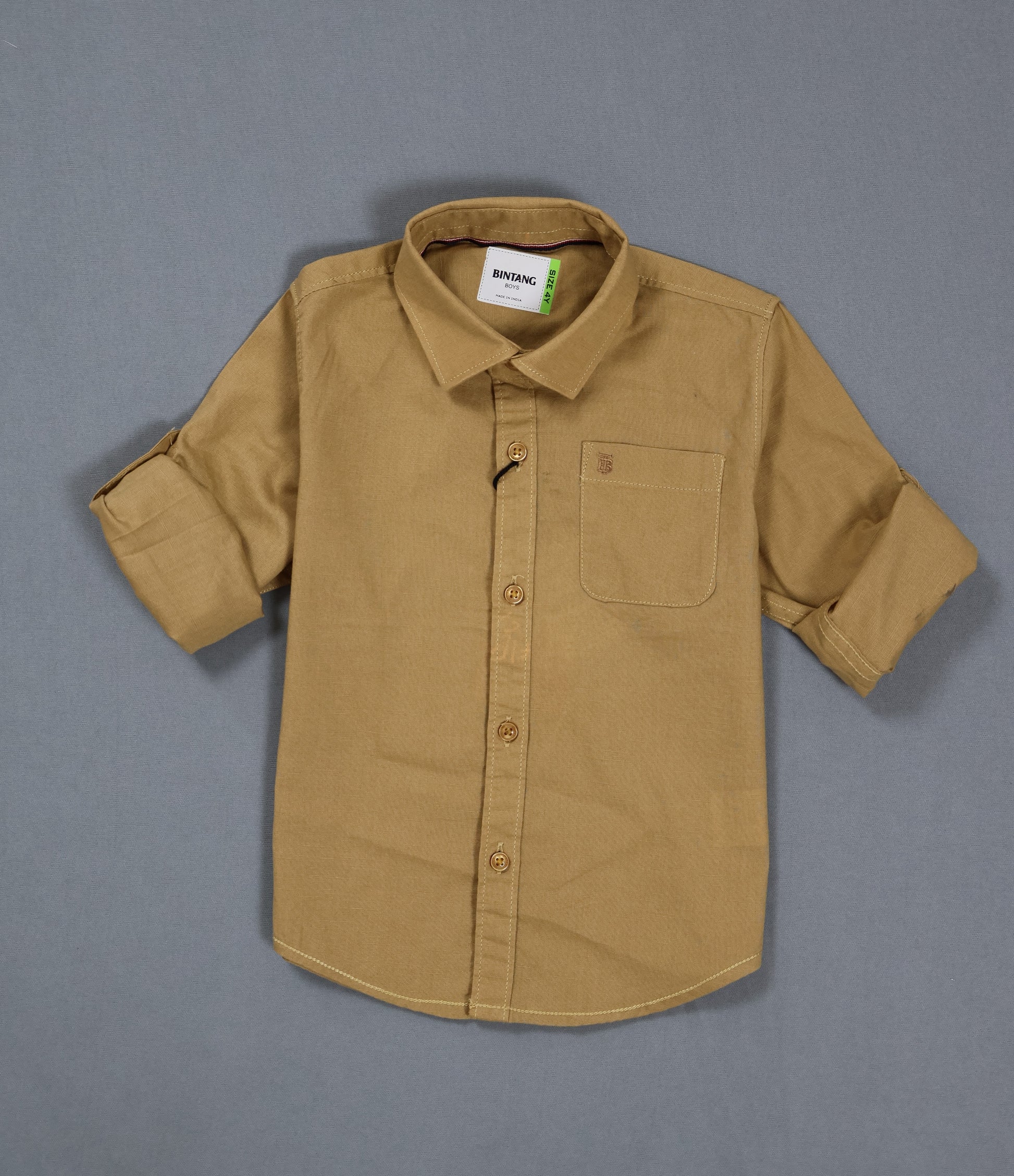Brown shirt with a collar and pocket on a gray background