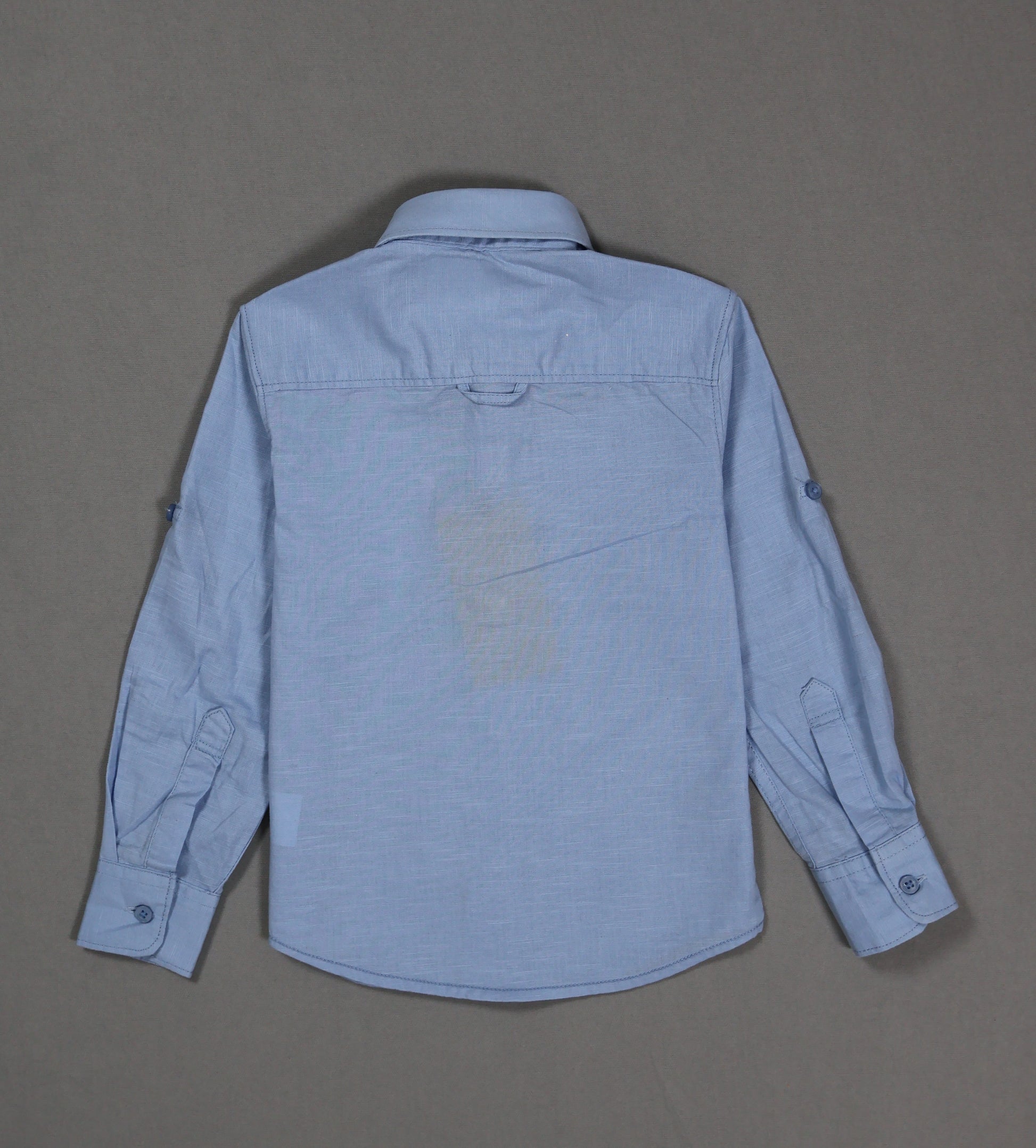 Blue shirt on a gray background