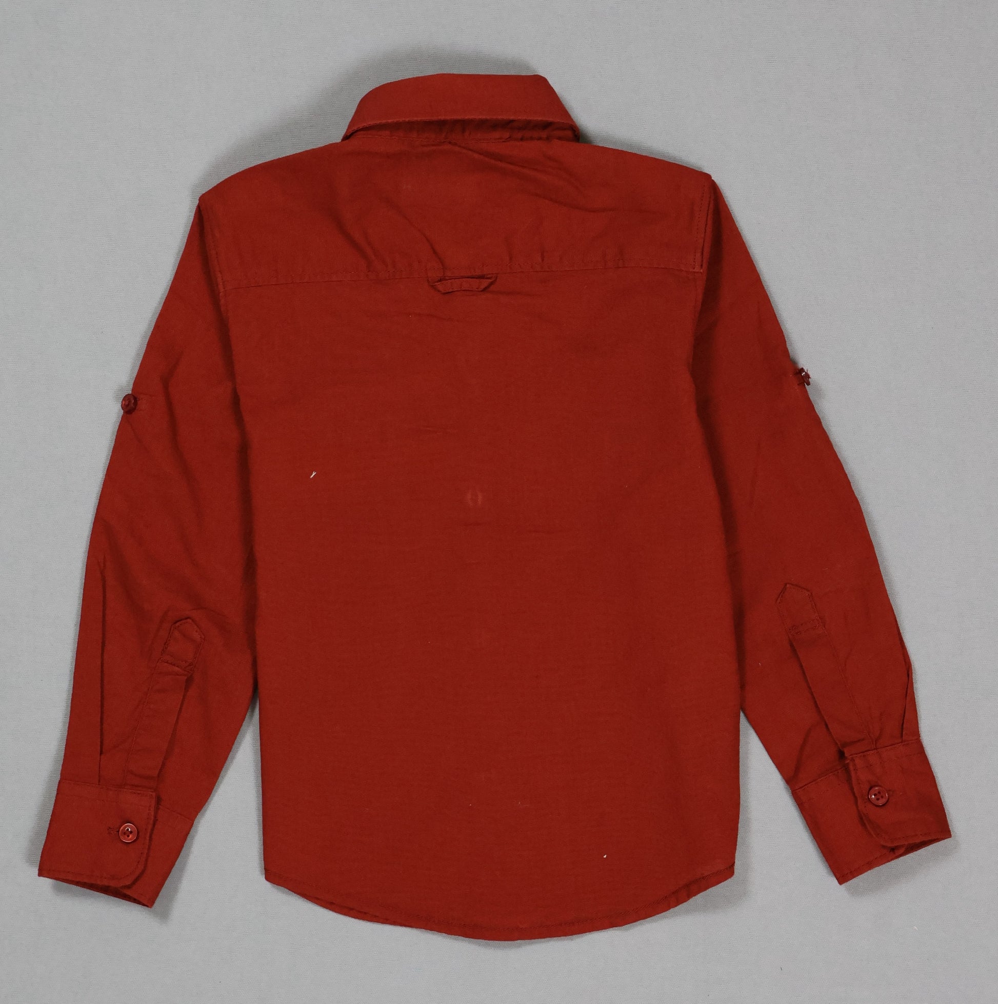 Red shirt on a gray background
