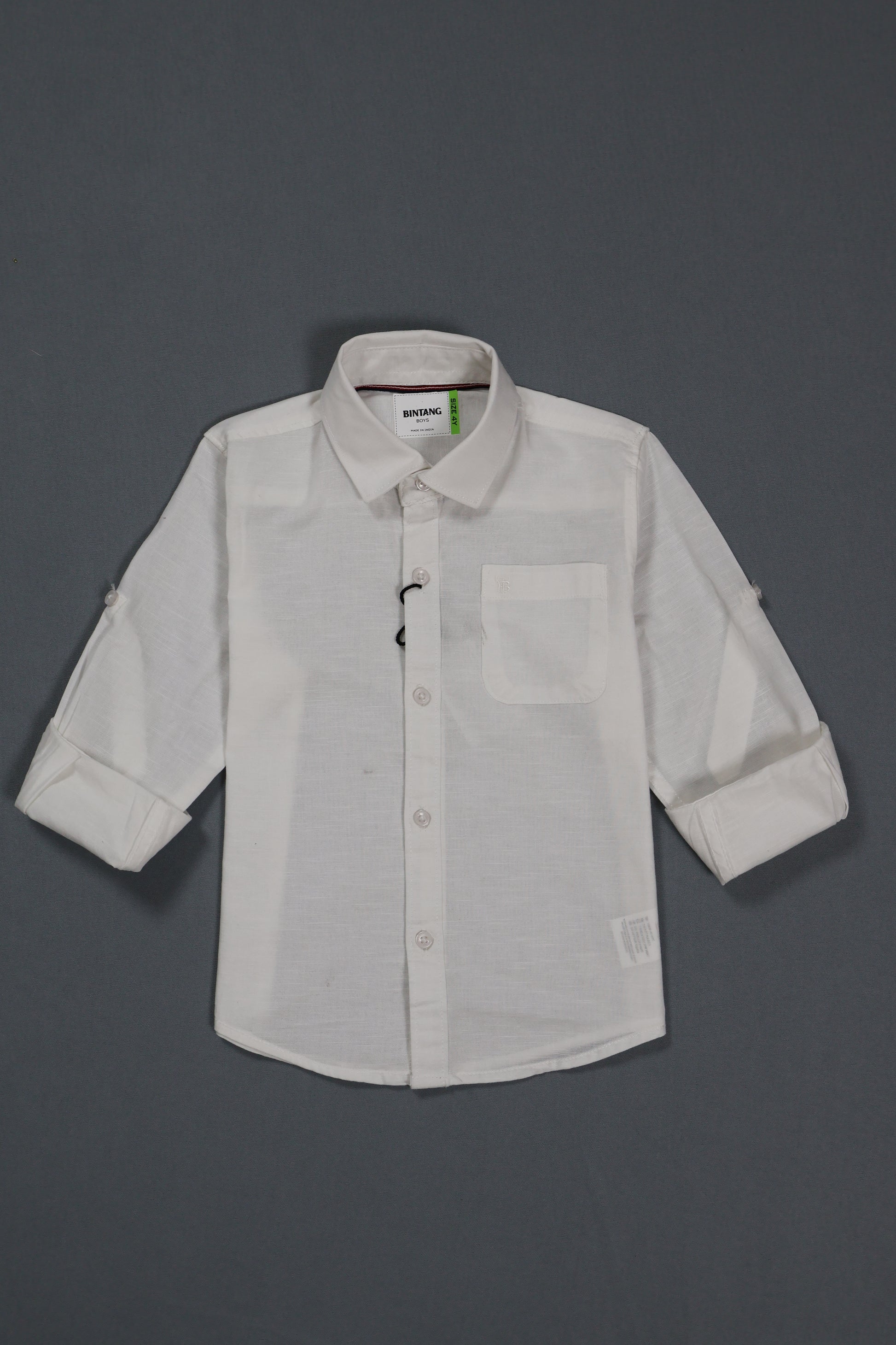 White shirt with rolled-up sleeves on a gray background