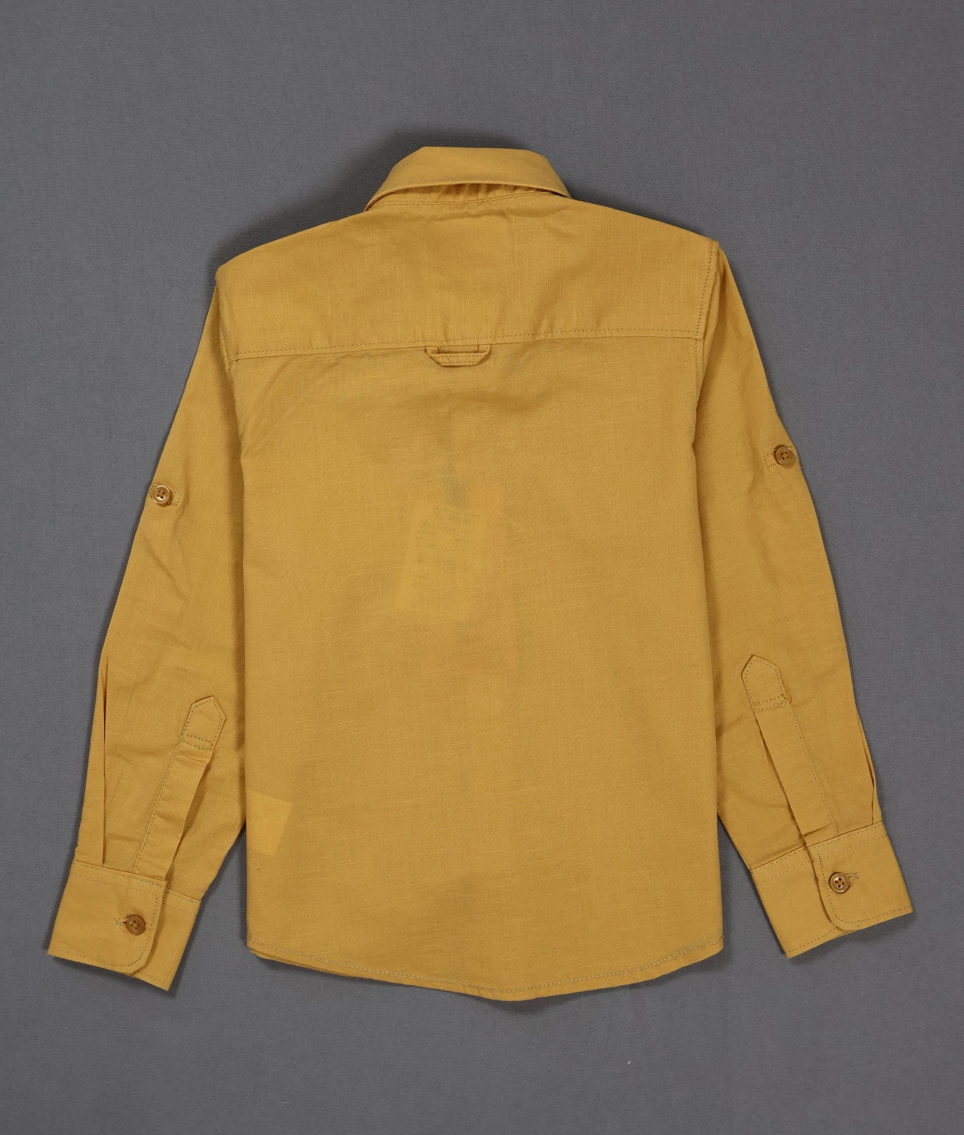 Yellow shirt on a gray background