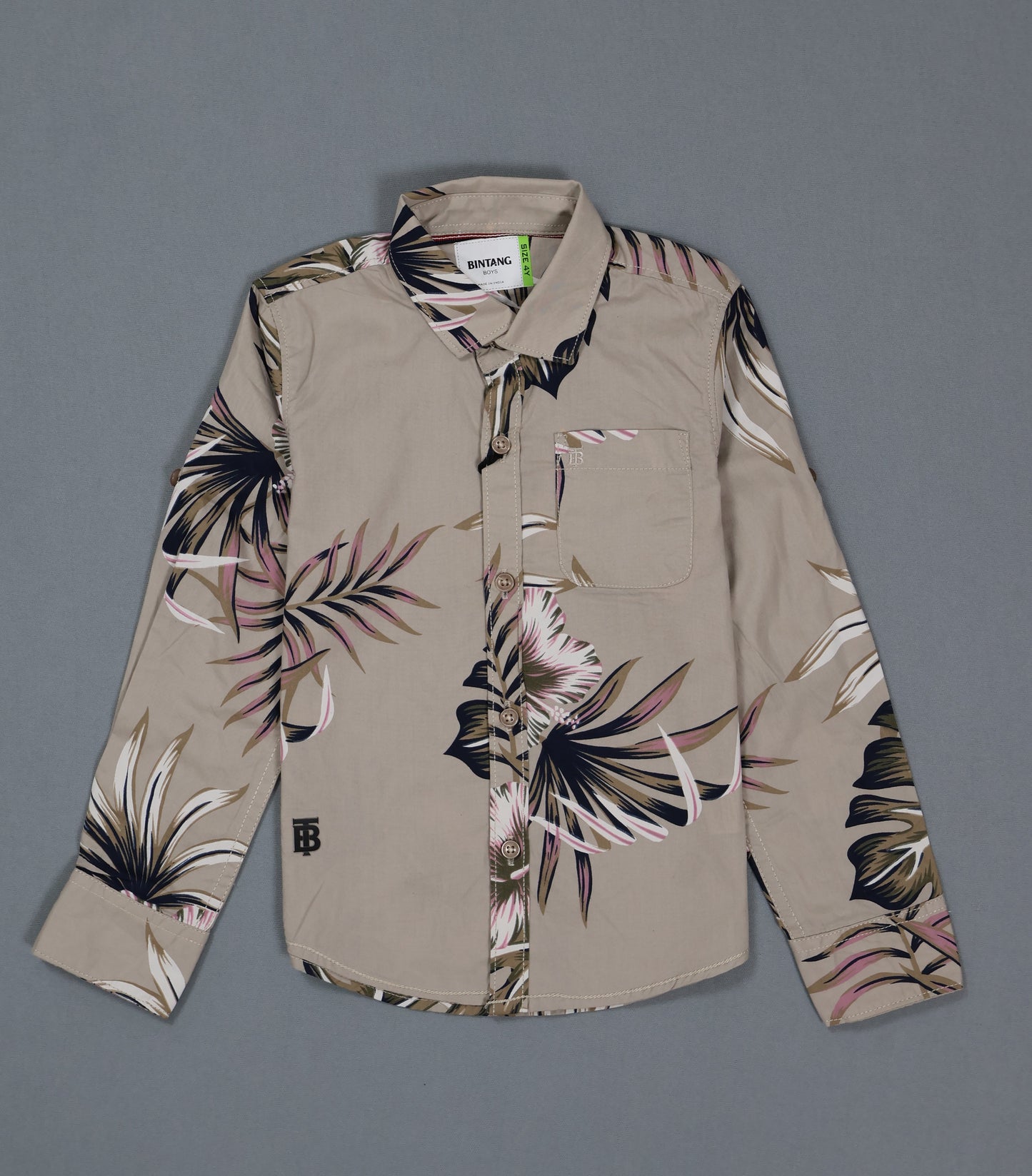Beige shirt with floral patterns on a gray background