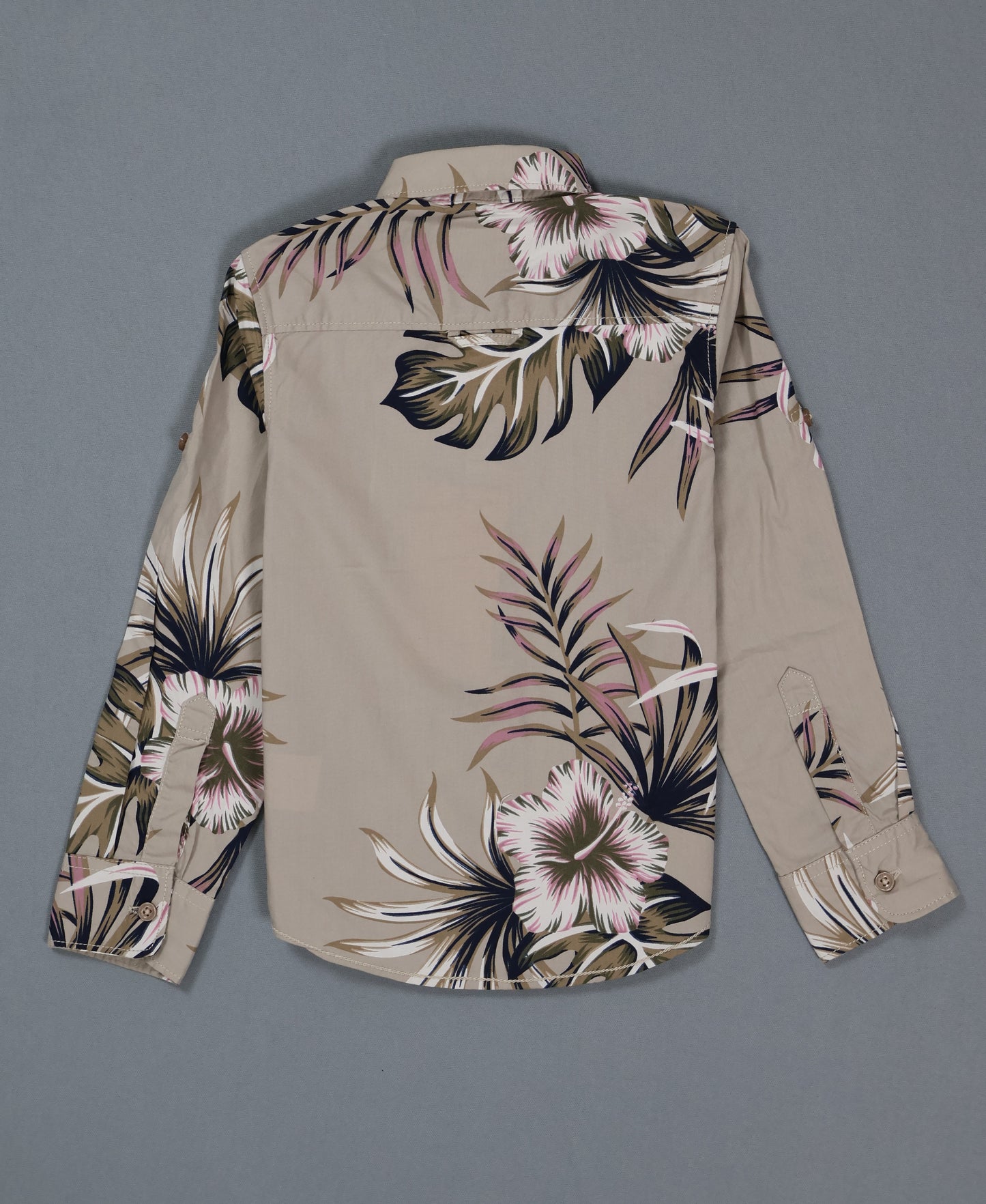 Beige shirt with floral pattern on a gray background