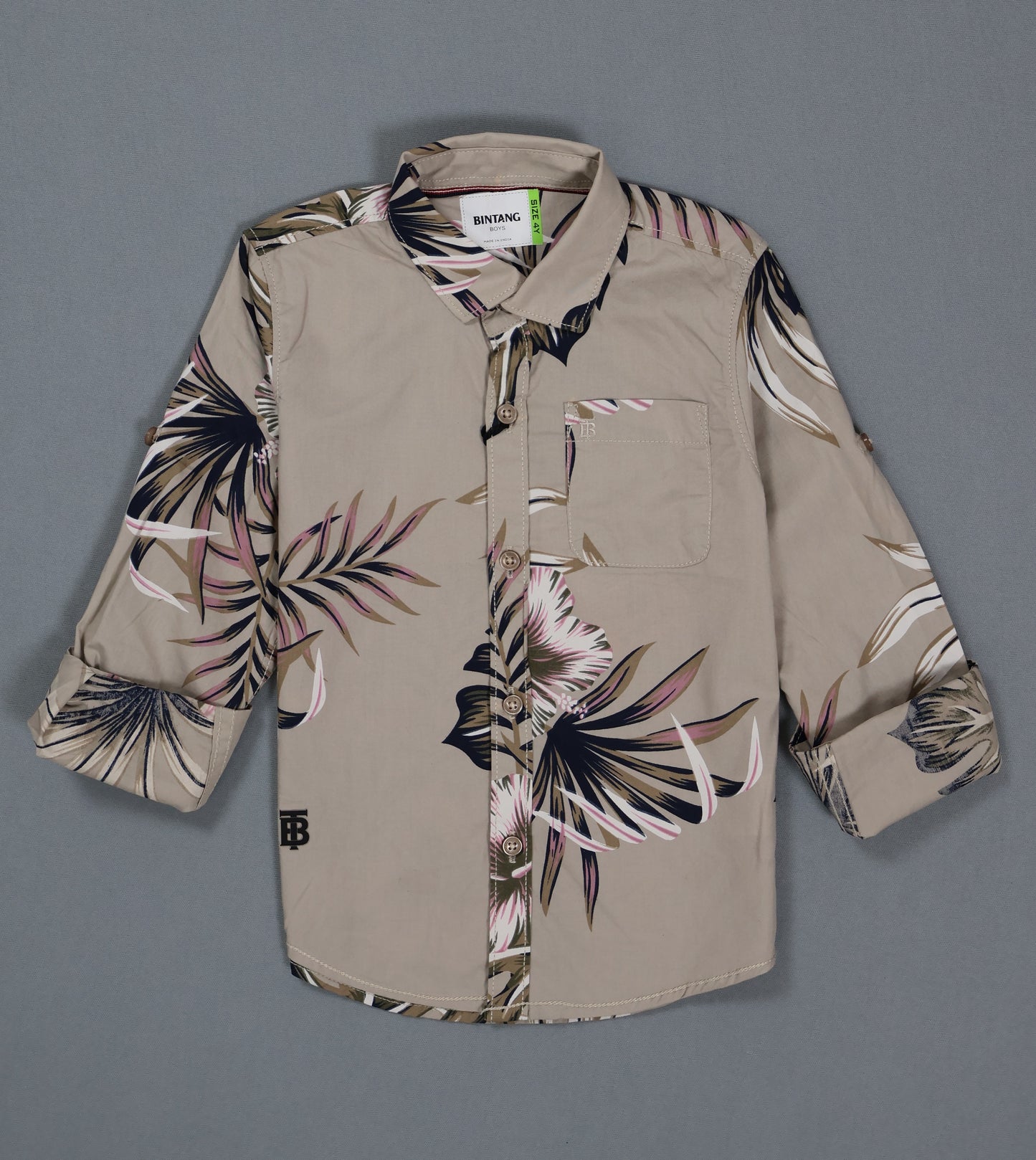Beige shirt with floral pattern on a gray background