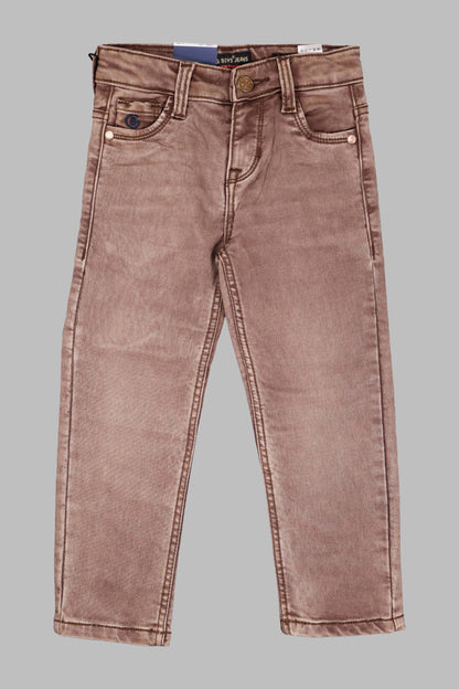 Brown jeans on a gray background