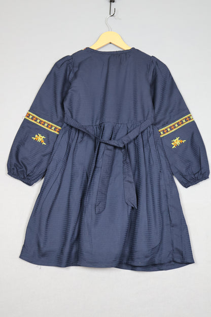 Blue garment with yellow embroidery on a white background