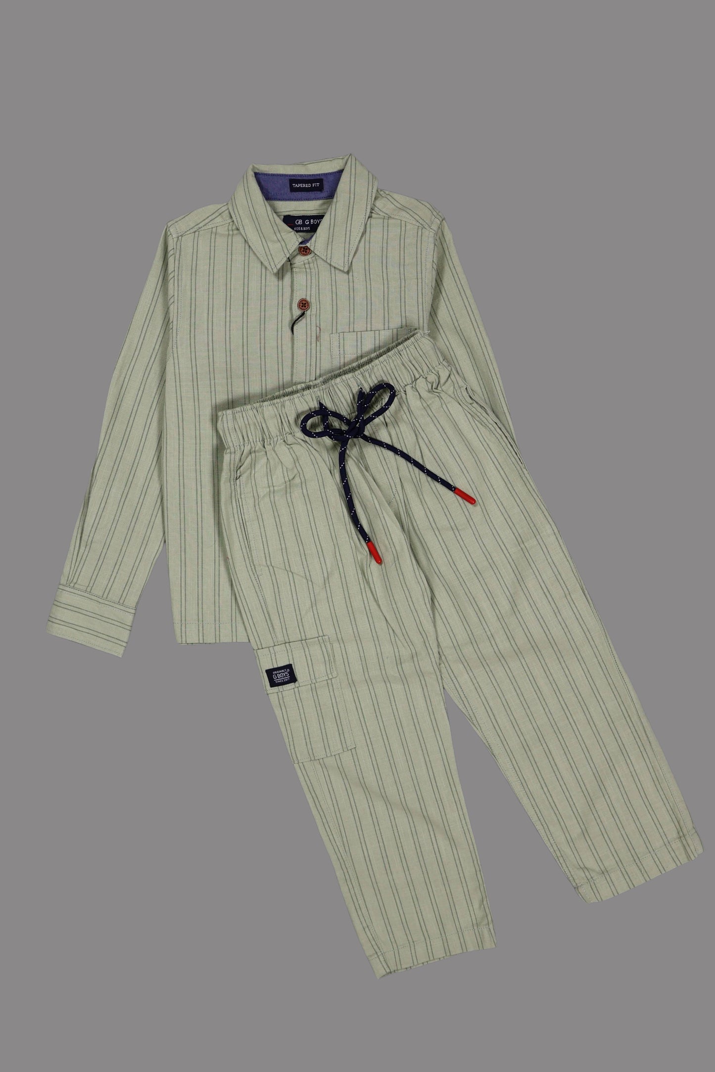 Green pinstripe pajama set on a gray background