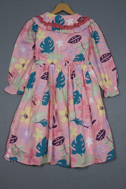 Blush pink cotton frock for girls with tropical floral print, long sleeves, and ruffle collar